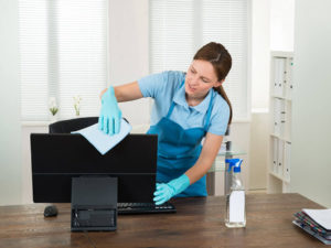 Lady cleaning dust in the office 