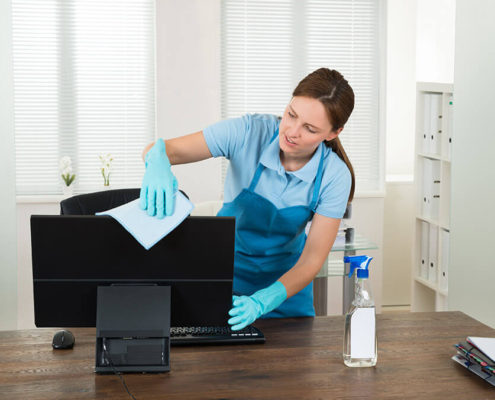 A Lady cleaning a local office in Kitchener-Waterloo