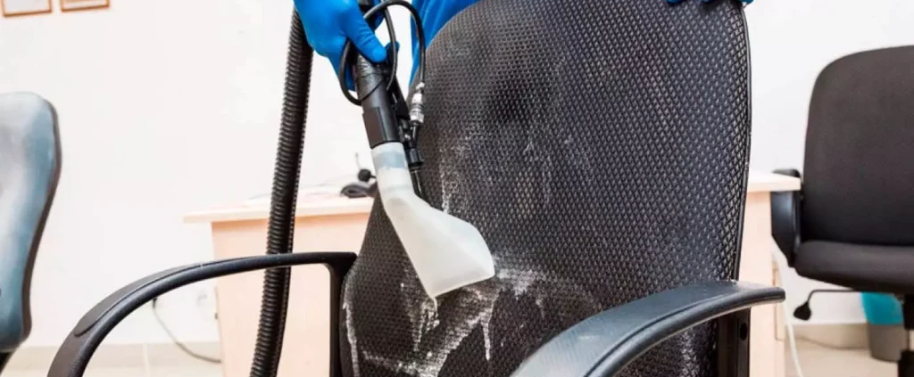 Demonstrating upholstery cleaning