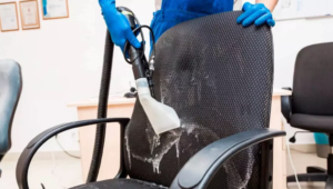 Demonstrating upholstery cleaning