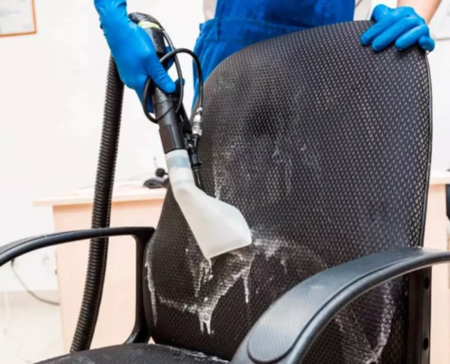 Demonstrating upholstery cleaning