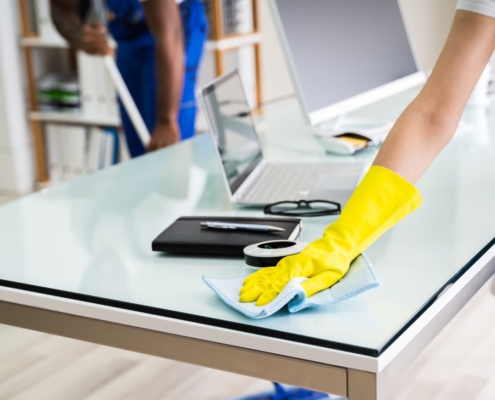 employees of a local commercial cleaning company cleaning an office